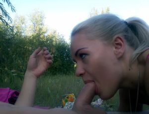Blond babe sucking dick outdoors
