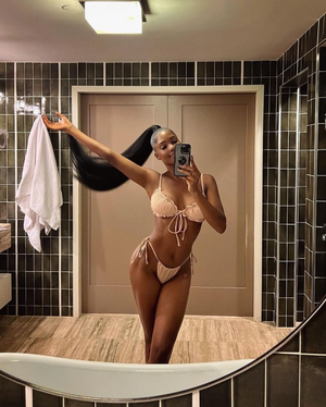The Beautiful LaNisha Cole taking a selfie in a bikini