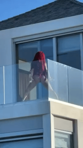 Saweetie twerking on the balcony