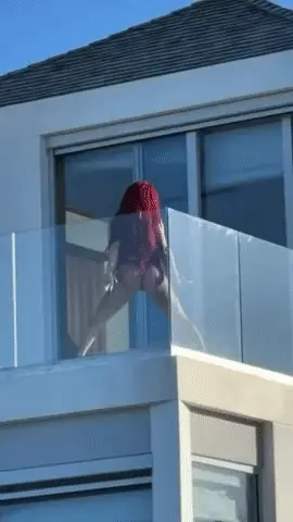 Saweetie twerking on the balcony