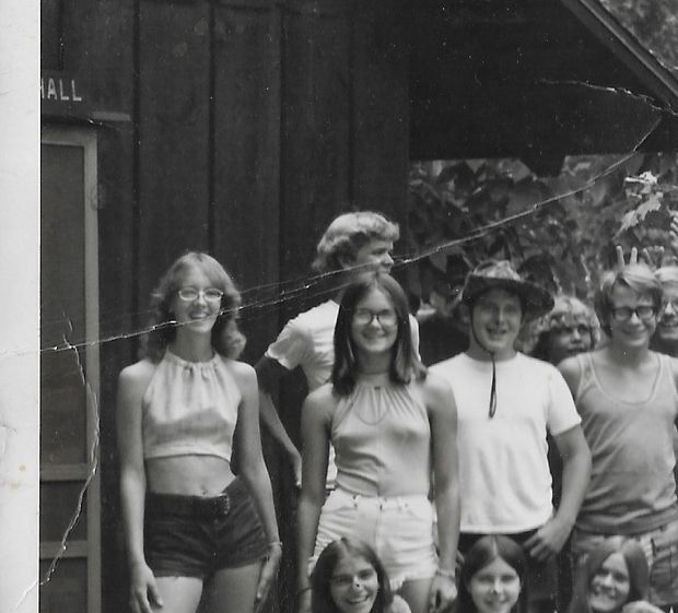 Summer camp 1970s--someone needs to let her know it is time for a bra--??