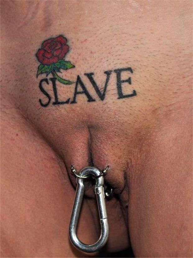 Pierced and tattooed slave twat