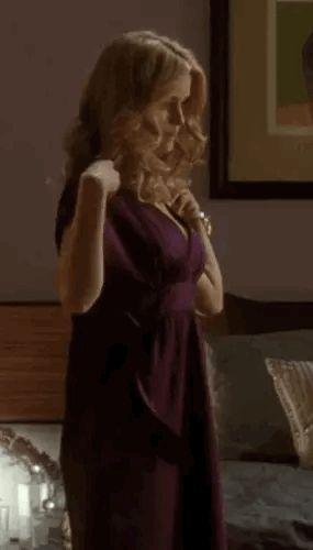 Alice Eve taking off dress