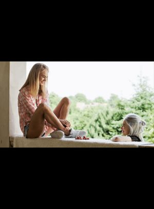 Blonde girlfriends enjoying each others company