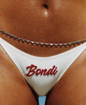 Tanned belly with chain