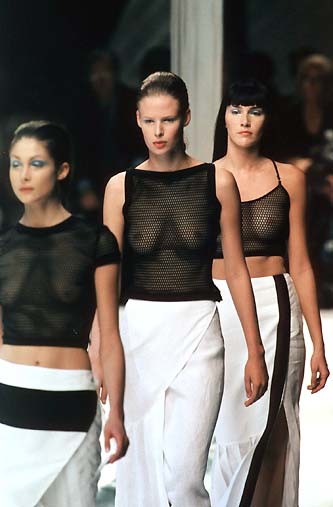 Trio of models catching a chill on the runway. Pin it.