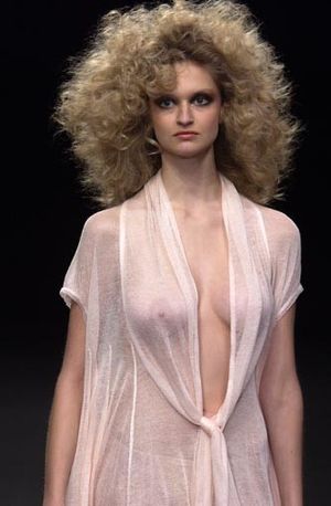 Big hair and nice tits.