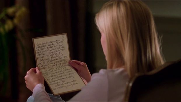 Reading the letter.