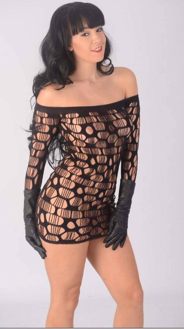 Gorgeous MILF Sammi Jo teasing her hot naked body in a see through fishnet dress