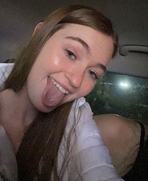 Cute redhead with her tongue ready