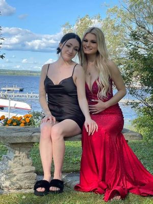 Grace and Lily Prom dresses hand on knee