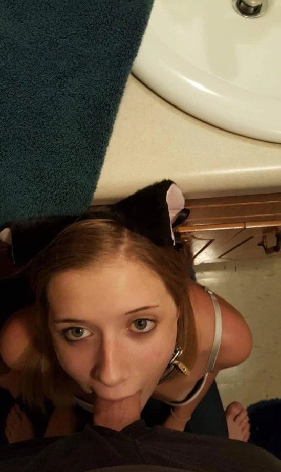 Cat ear'd and collared sub brunette with dick in her mouth