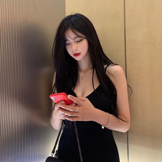 Texting her pimp.