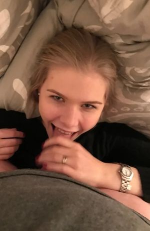 Happy blond being fed a cock to suck