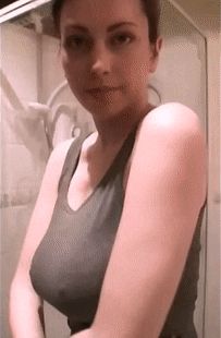 Woman with big tits undressing
