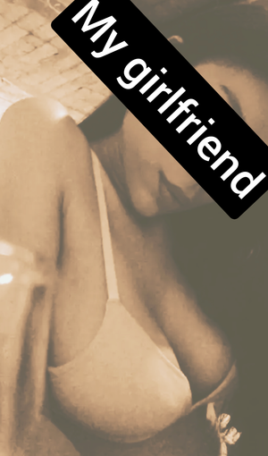 My brunette girlfriend teasing me showing her natural tits and cleavage . Do you like her?