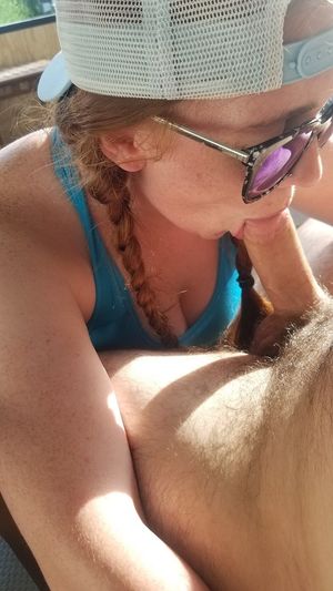 lass in a tank top giving her man what he needs