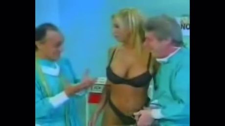 Horny old doctor listening to Latina's heartbeat with a stethoscope.