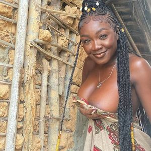 Folashade Oremakinde showing off her cleavage