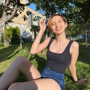 thin cutie sitting outside