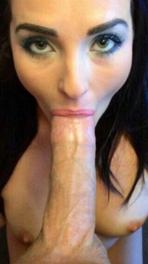 Beautiful green-eyed brunette sucking on a big dick