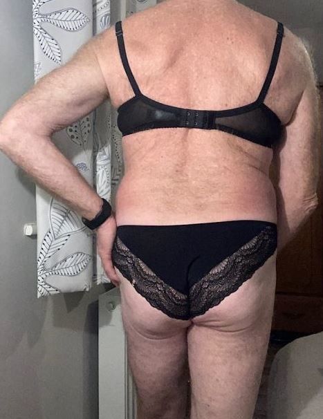 Cute grandpa wearing bra and pants backside