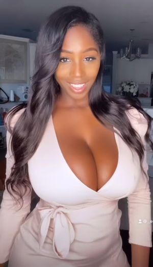 Ellie Mae white top cleavage smile 2