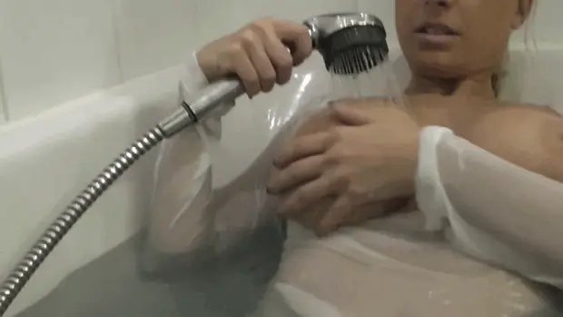 Relaxing dressed in the bathtub