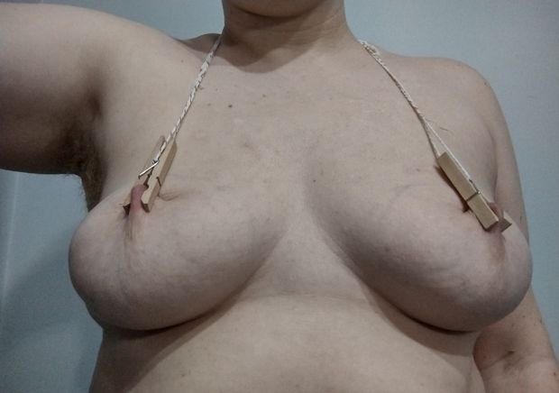 clothespins on my nipples tied together behind my neck