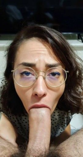 Amateur brunette teen with glasses and big dick in her mouth