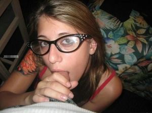 Amateur brunette in glasses giving head