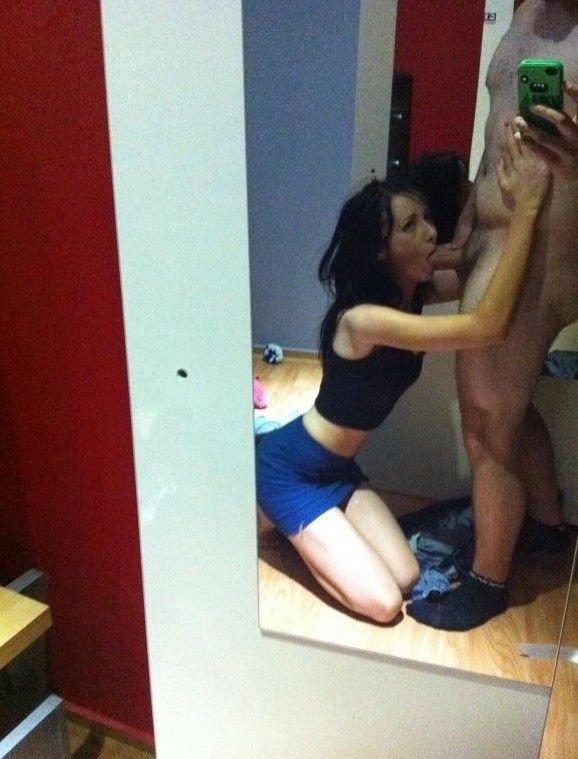 Super hot brunette on her knees sucking in a mirror-shot