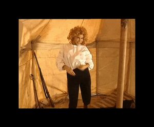 Countess and mistress Milly does a striptease in a tent full of soldiers ! She stylishly takes off her pants and shows off her great ass