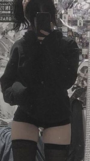 Pale alt babe shows off stockings