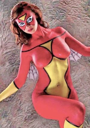 SpiderWoman is captured by a pair of large cocked men who make her their plaything