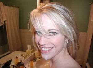 Super pretty blond smiling with cum on her chin