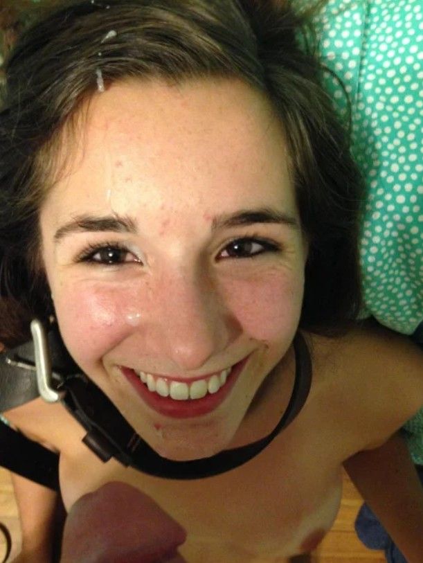 Cute brunette with a facial and belt around her neck