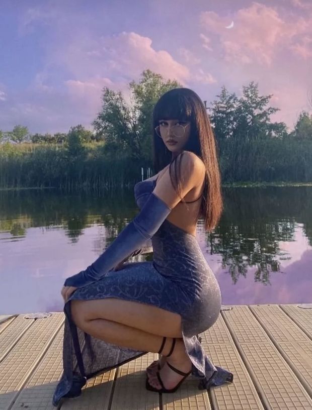 sexy big ass bunette babe wearing a hot revealing dress