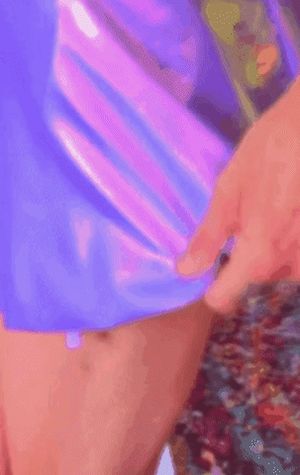 Damn! She’s hiding her huge, hard cock under that sexy, shiny skirt!