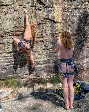 Two babes rock climbing