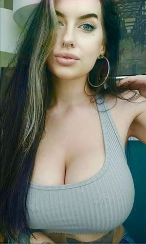 That tank top is barely hanging on!