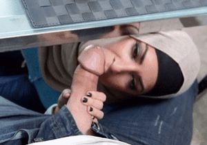 Muslim slut worshipping a big fat white cock under the table