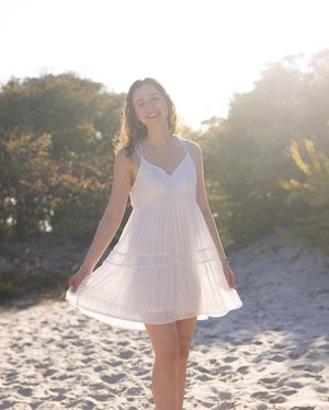 sun shining through her white dress