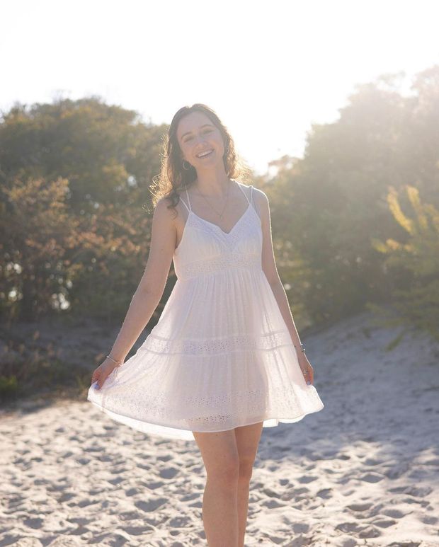 sun shining through her white dress