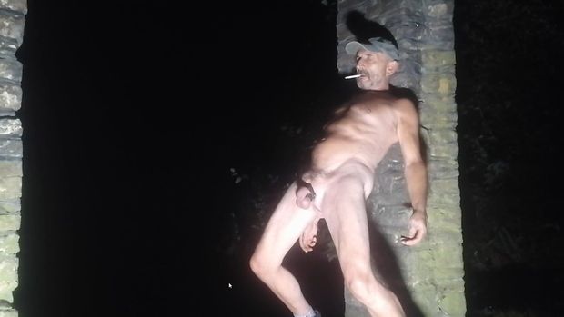 Naked male outdoors in public place