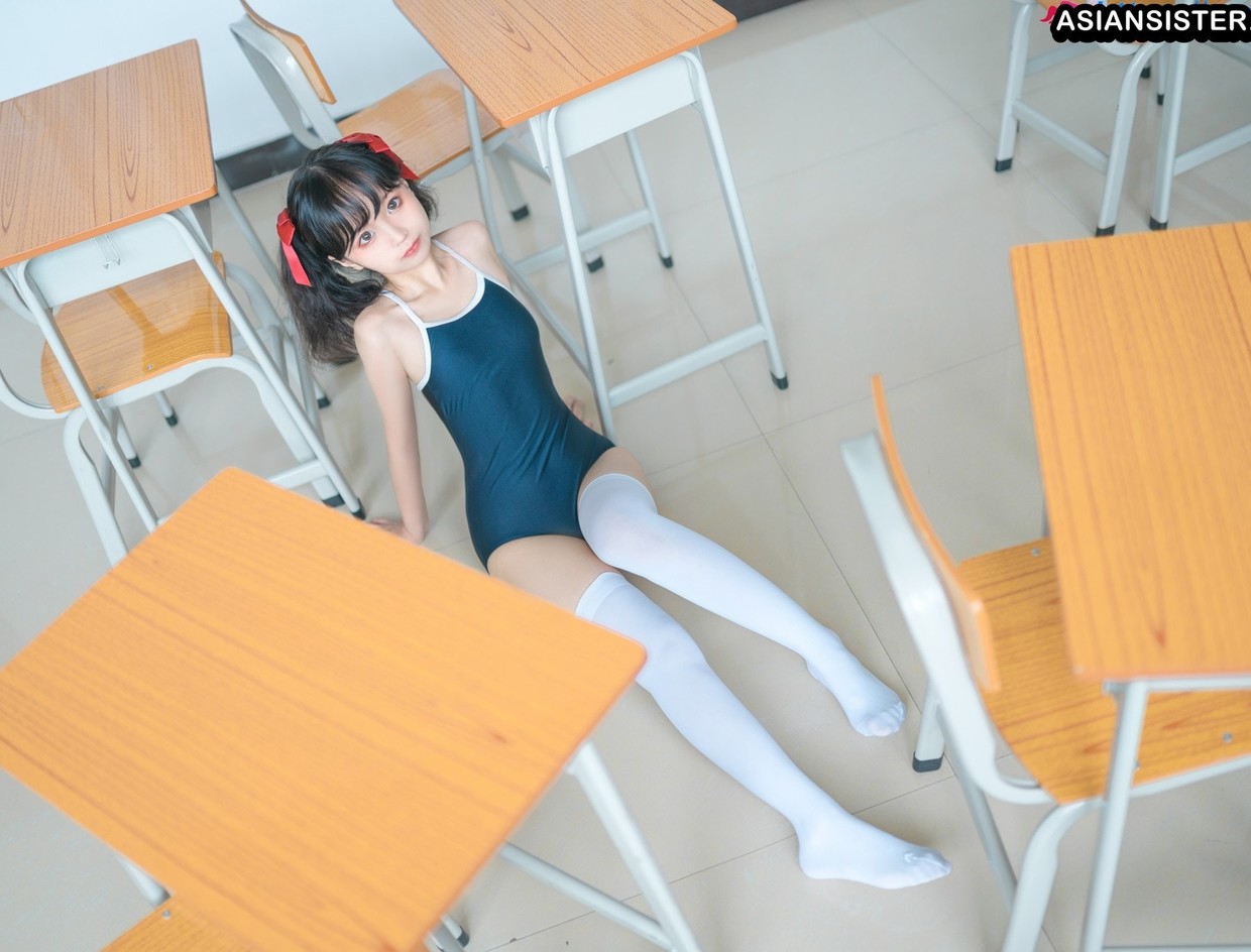 Asian doll on classroom floor