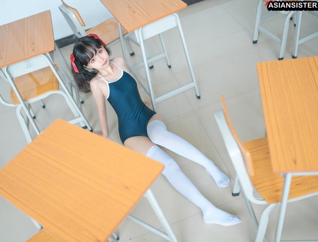Asian doll on classroom floor