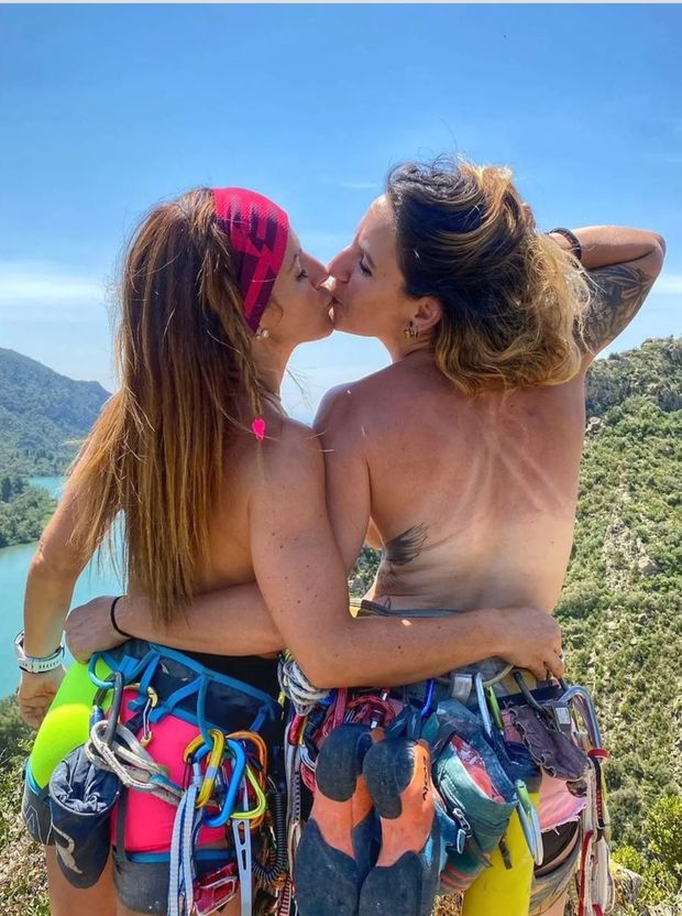 Topless lesbian climbers kiss