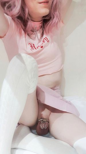 Over the knee socks, a tight collar, and a cute little skirt to go with my smallest cage