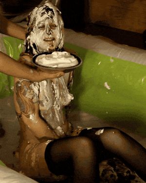 Sexy babe pied in the face